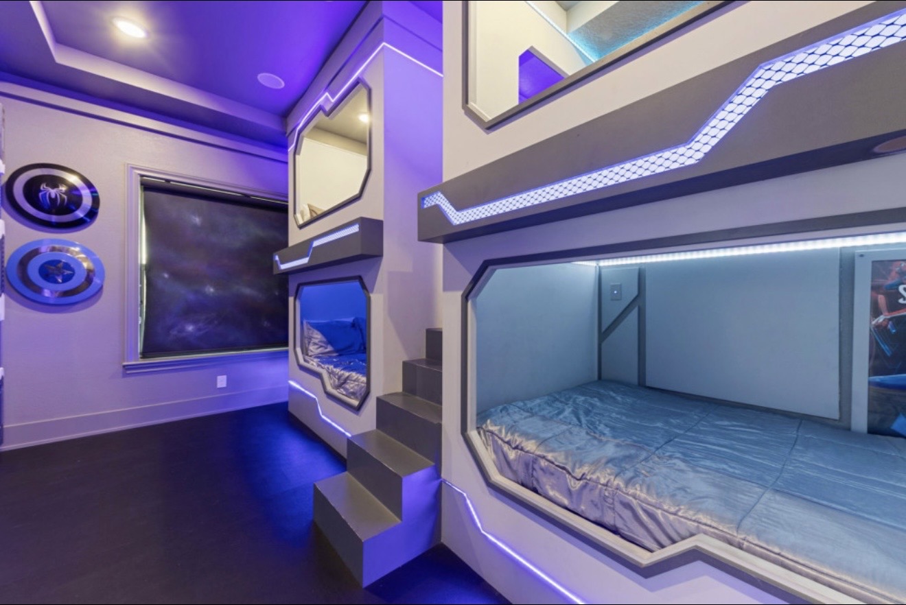 Marvel-themed shared room with futuristic built-in bunk beds