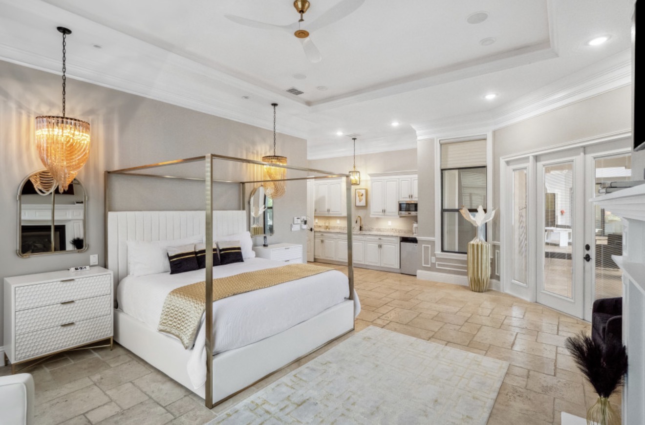 Private villa suite with a four-poster bed and kitchenette