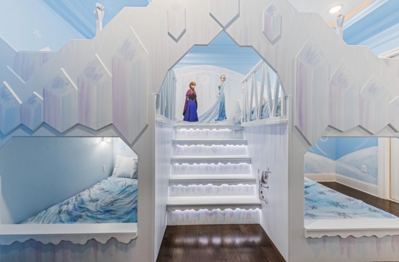 Frozen-themed shared room with four built-in beds and illuminated stairs