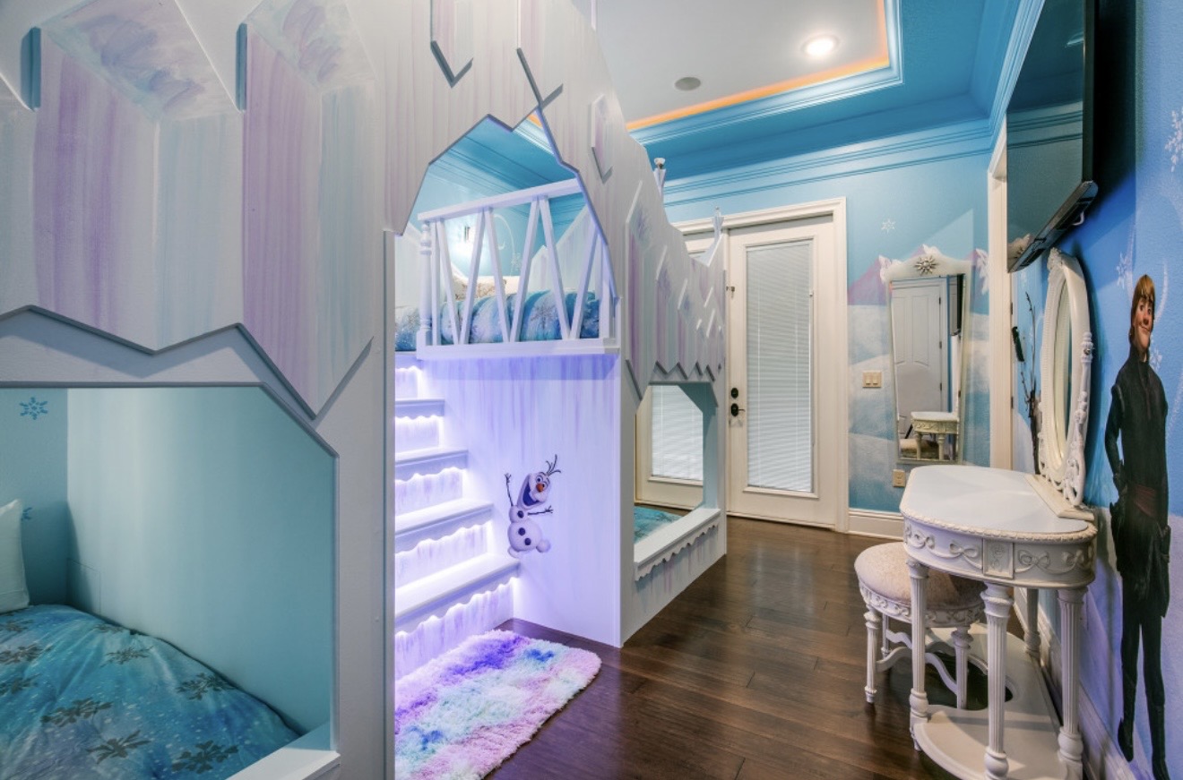Frozen-themed shared room with illuminated bunk beds and dressing table