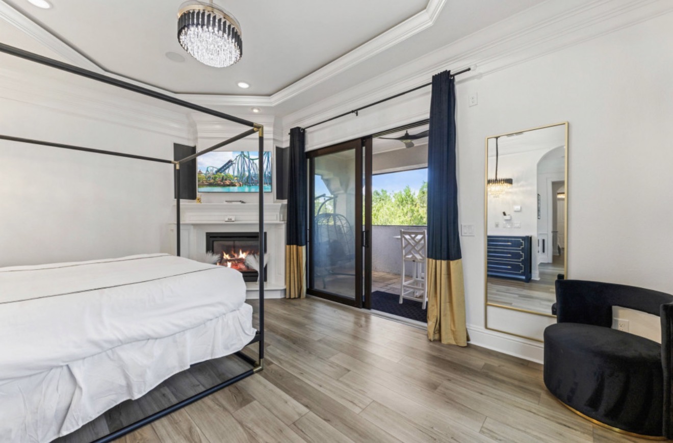Elegant premier suite with a four-poster bed and private patio doors